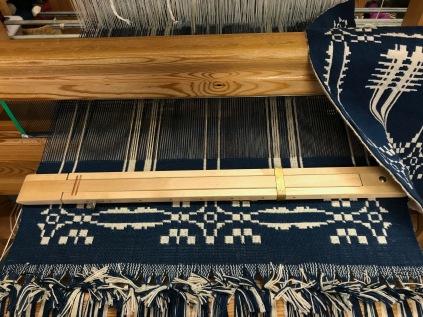 In work on the loom